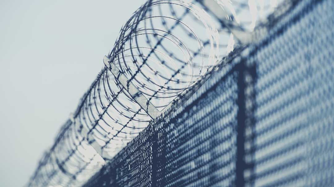 barbed fence around prison