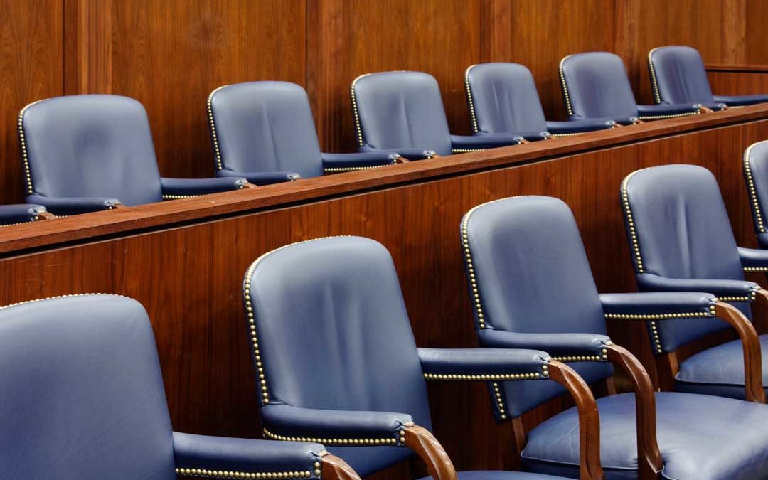 empty jury seats in courtroom